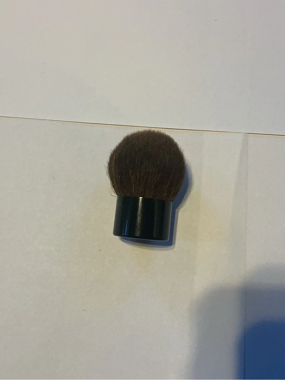 Chanel Kabuki Brush, 2” high by 1.5” wide